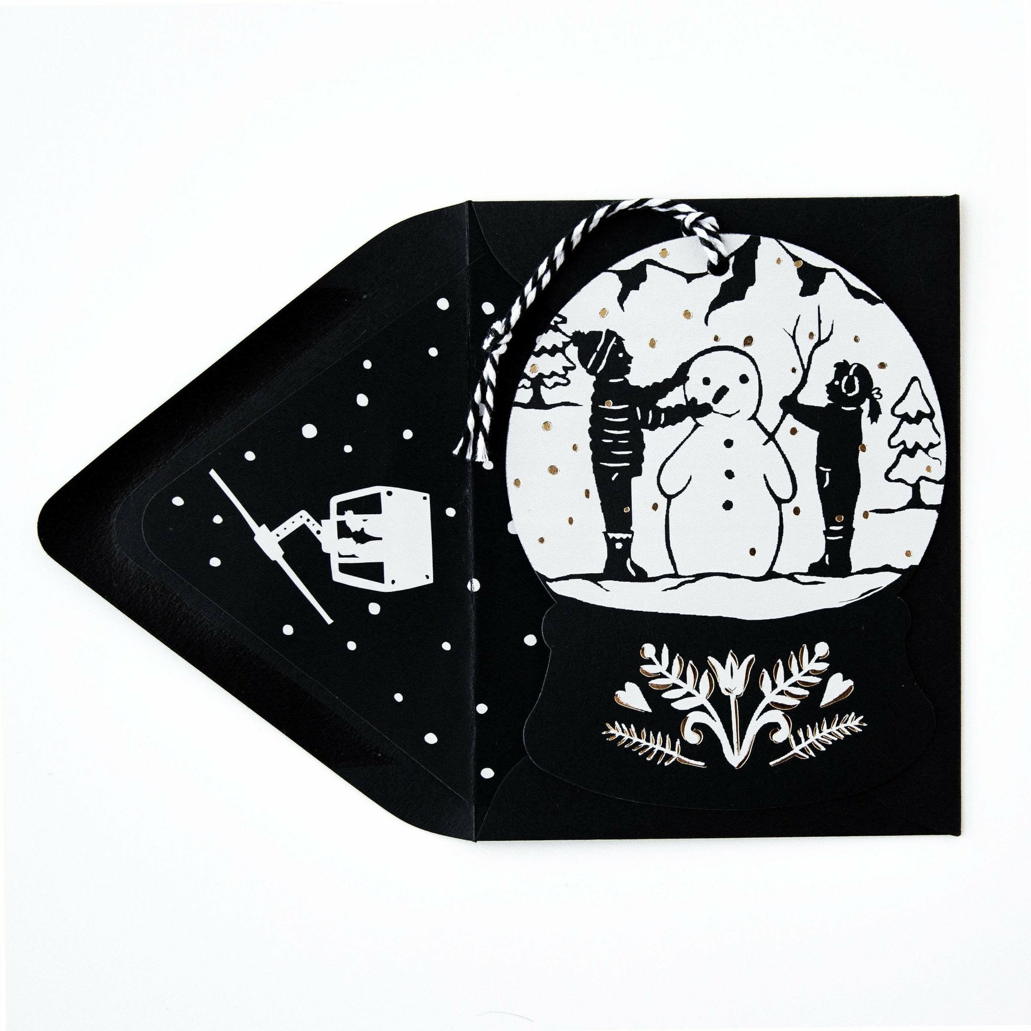 Snowglobe-Shaped Papercut Christmas Card and Envelope with Snowman - The First Snow